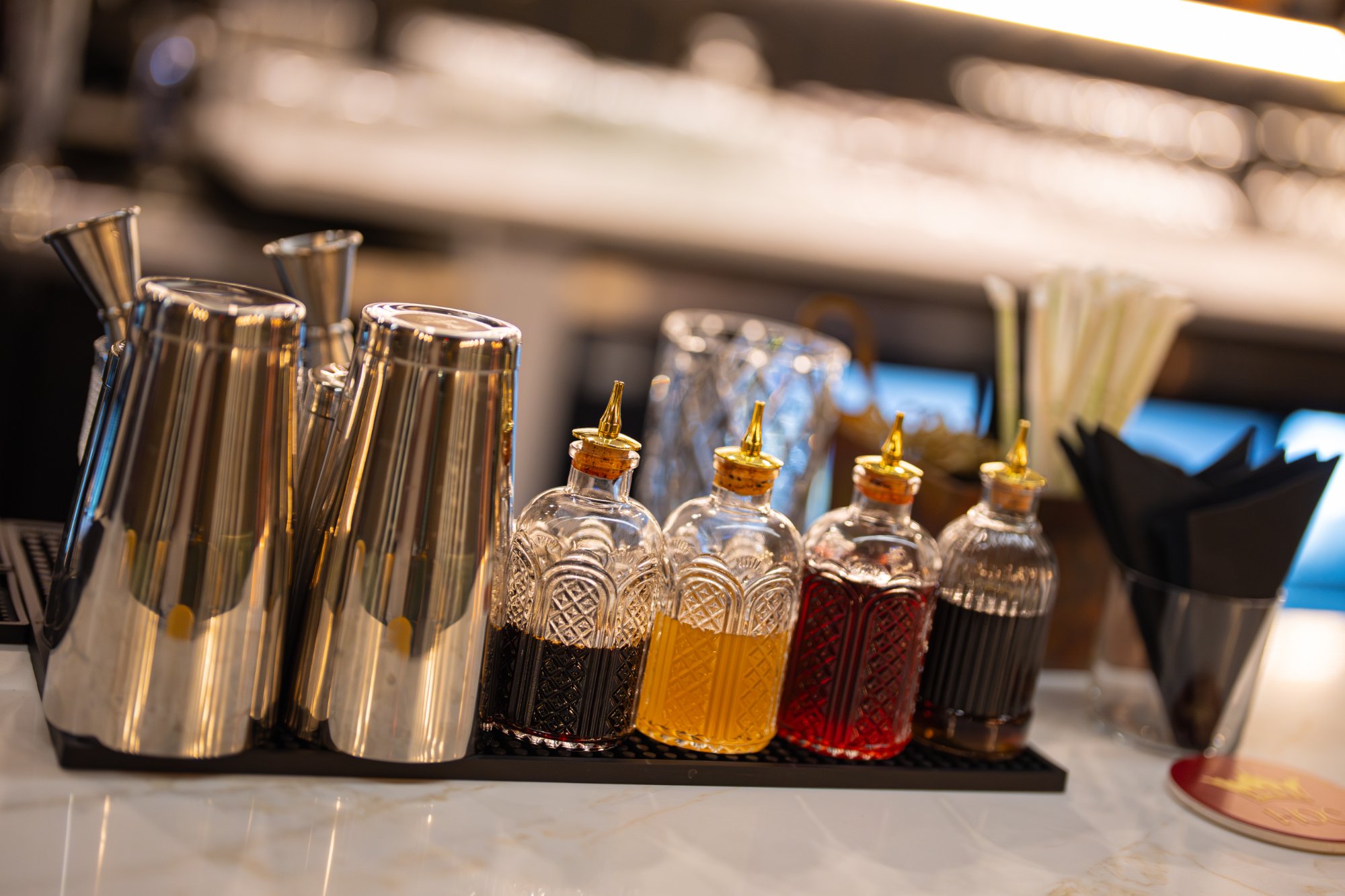 Bar tools shakers bitters bottles setup Aruvi bar House of Chettinad Leander TX