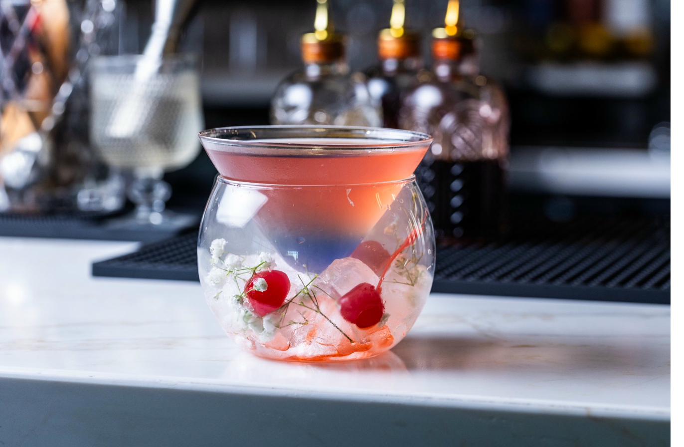 Leander Dusk cocktail hibiscus vodka butterfly pea flower Aruvi bar House of Chettinad